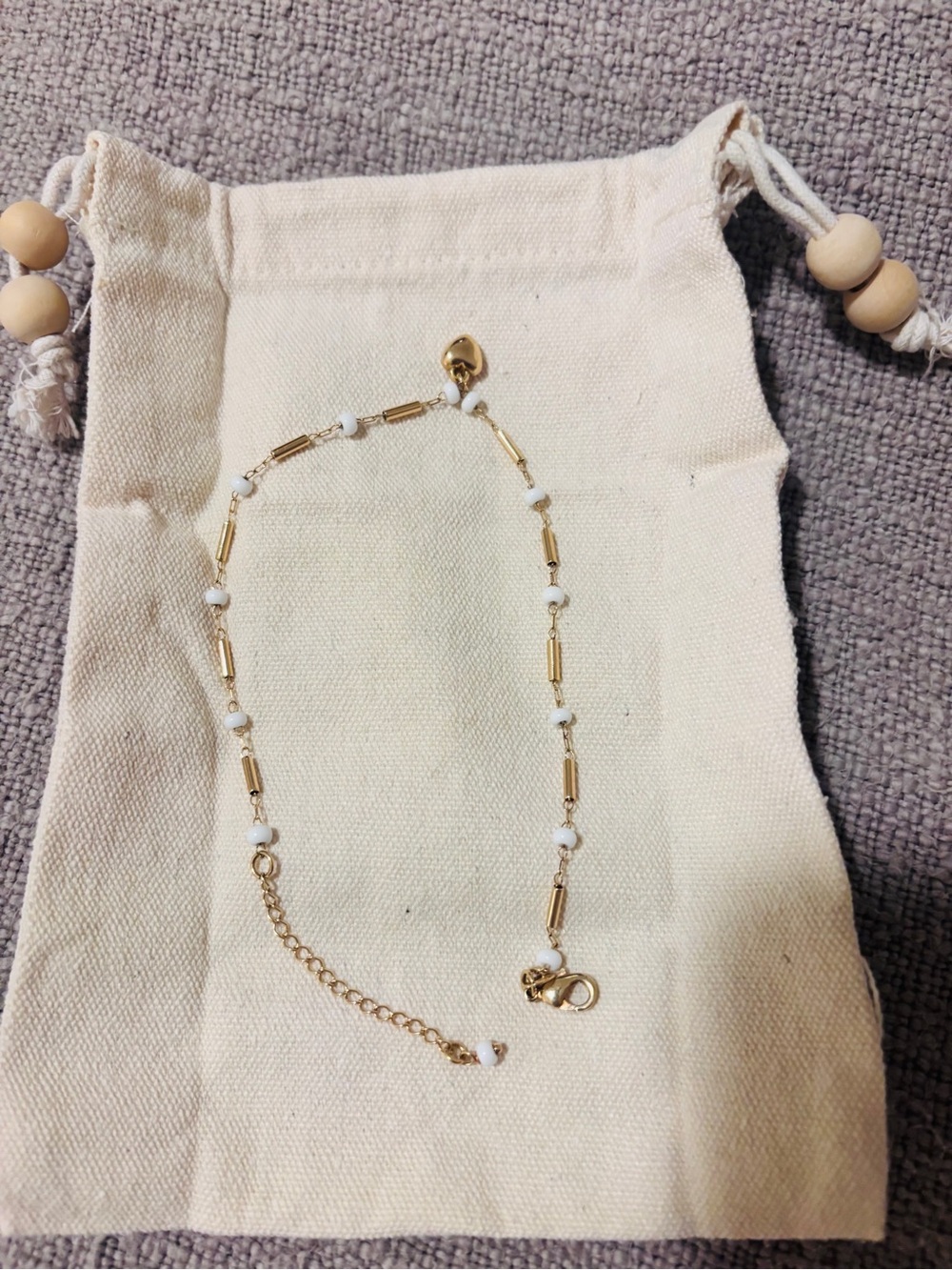 Ankle Bracelet gold-plated with a heart charm. 10”-12” adjustable lobster clasp
